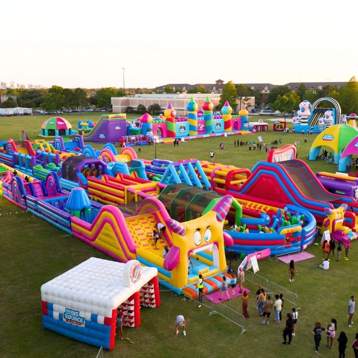 Colorful inflatable playground with slides, tunnels, and climbing obstacles