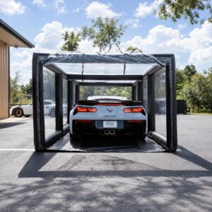 Clear inflatable car enclosure with a black frame surrounding a sports car