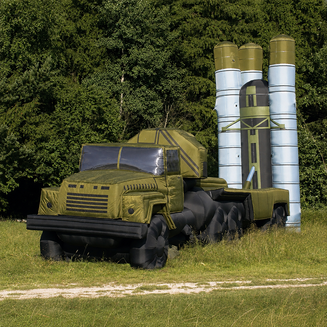 Inflatable military truck model with two tall cylindrical launch tubes