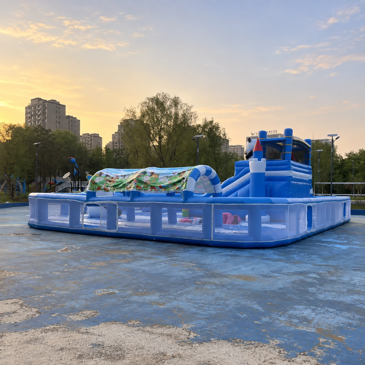 Blue inflatable play enclosure with a tall climbing slide