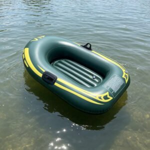 Dark green inflatable boat with yellow accents floating on water
