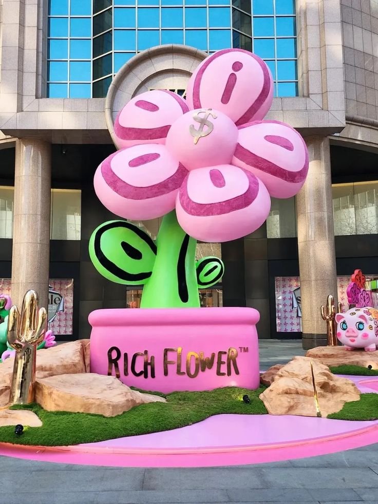 Giant pink inflatable flower in a pink pot
