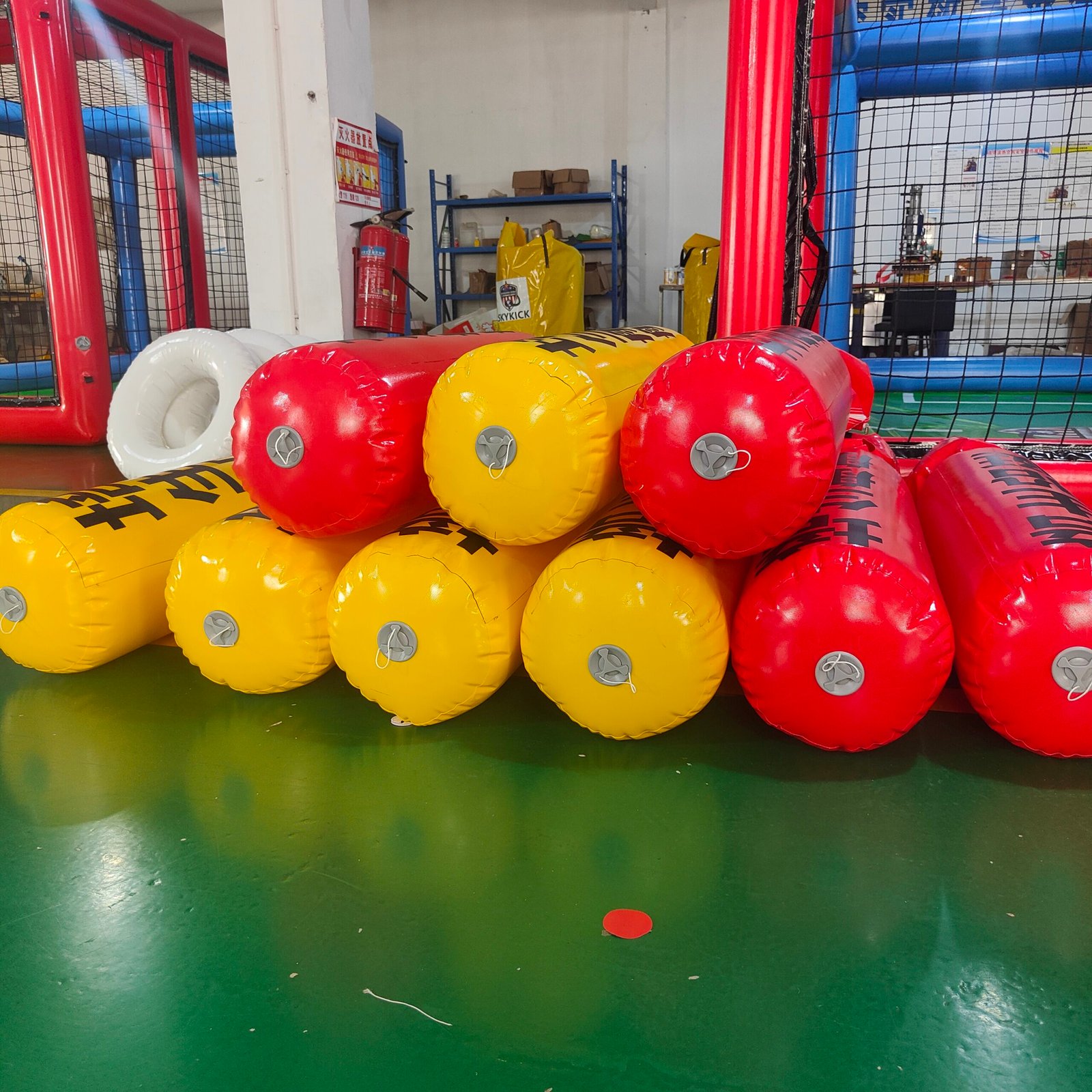 Stacked red and yellow inflatable cylindrical floats