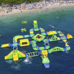 Aerial view of a yellow and green floating inflatable obstacle course