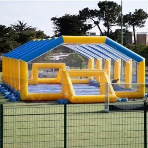 Yellow and blue inflatable soccer enclosure with netted walls and roof