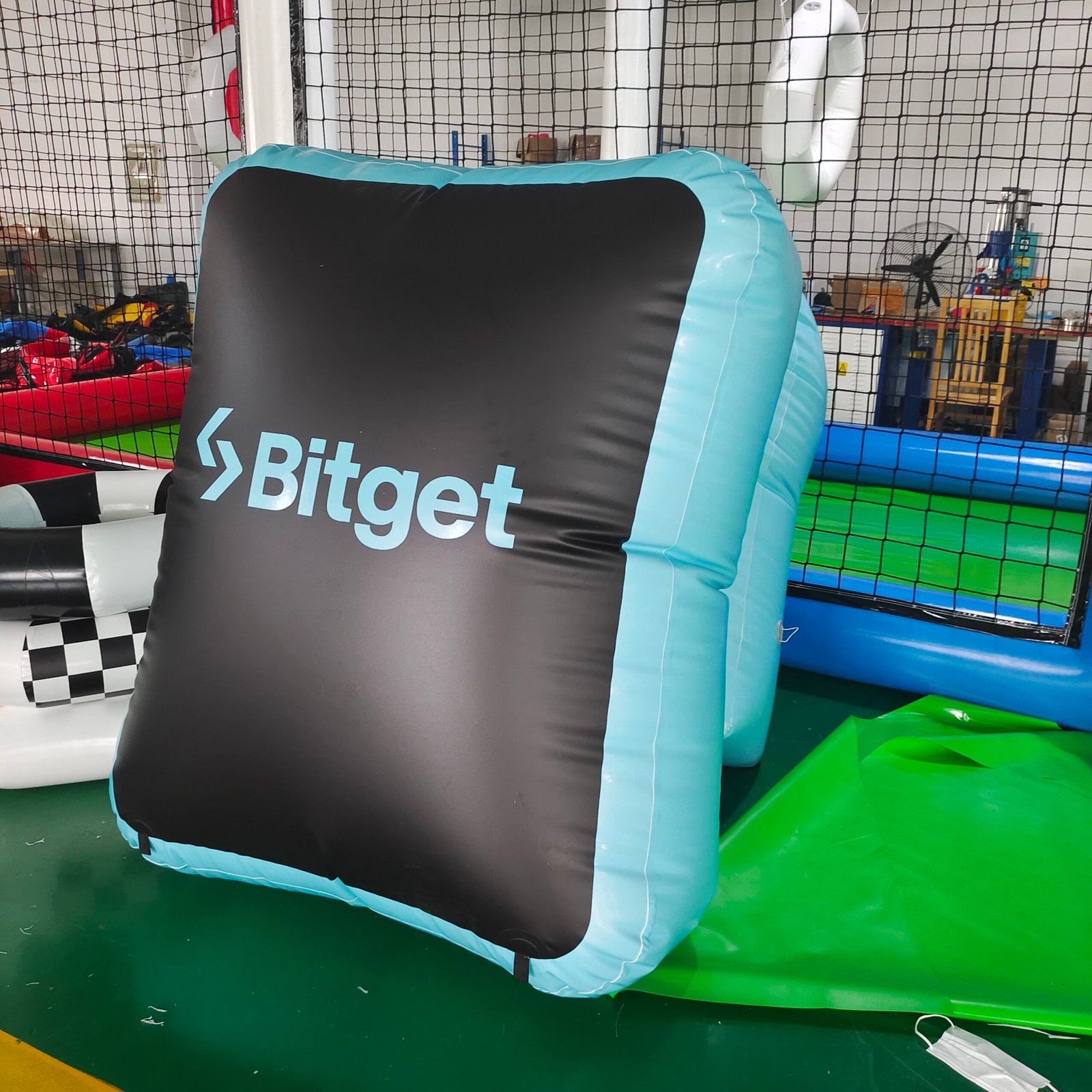Black and turquoise inflatable panel with Bitget branding
