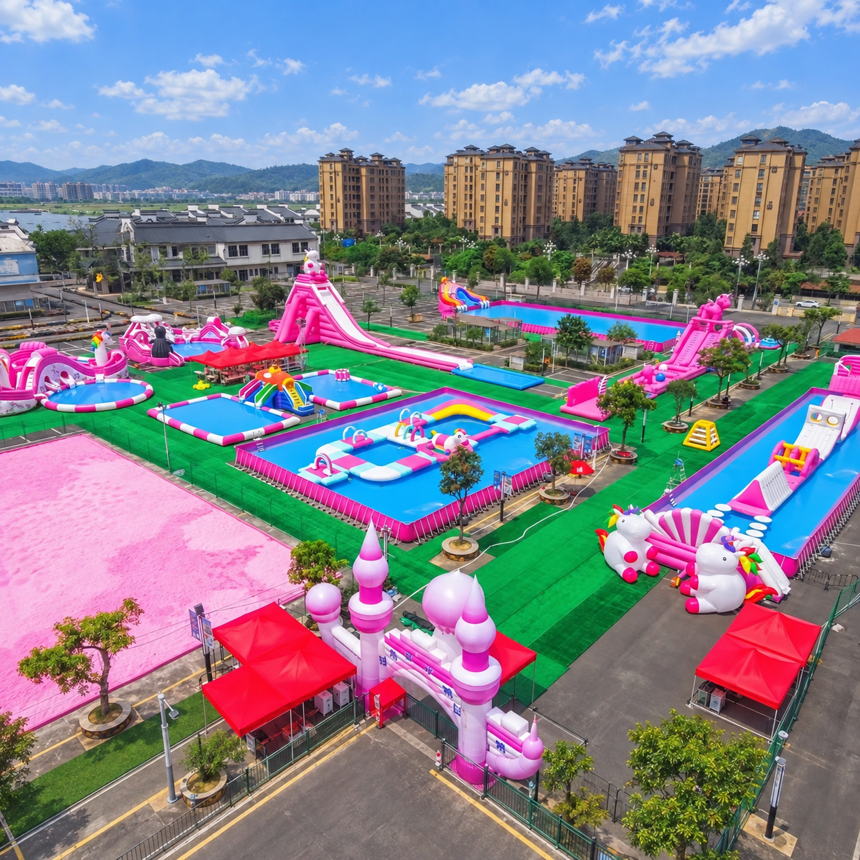 Aerial view of a pink-themed inflatable water park beside apartment buildings