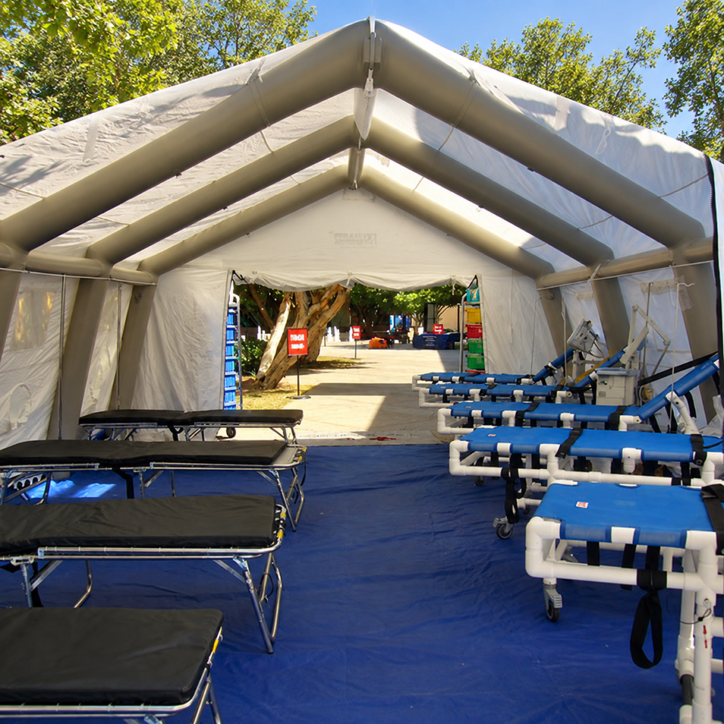 Interior of an inflatable medical tent with rows of beds