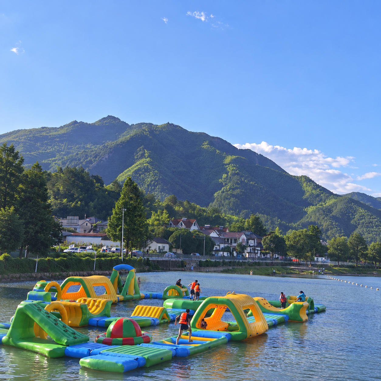 Green and yellow floating inflatable obstacle course on a mountain lake