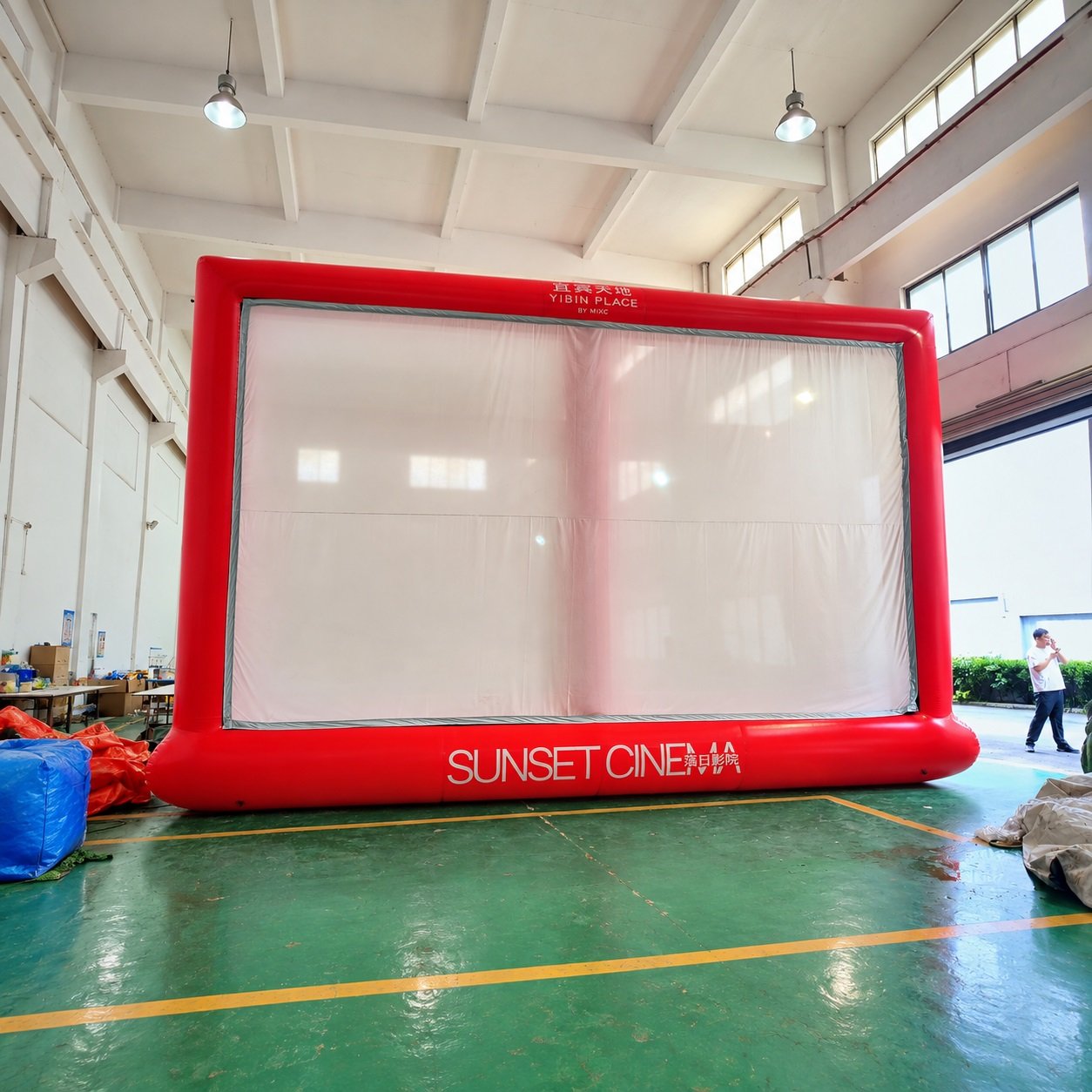Red inflatable projection screen with Sunset Cinema lettering