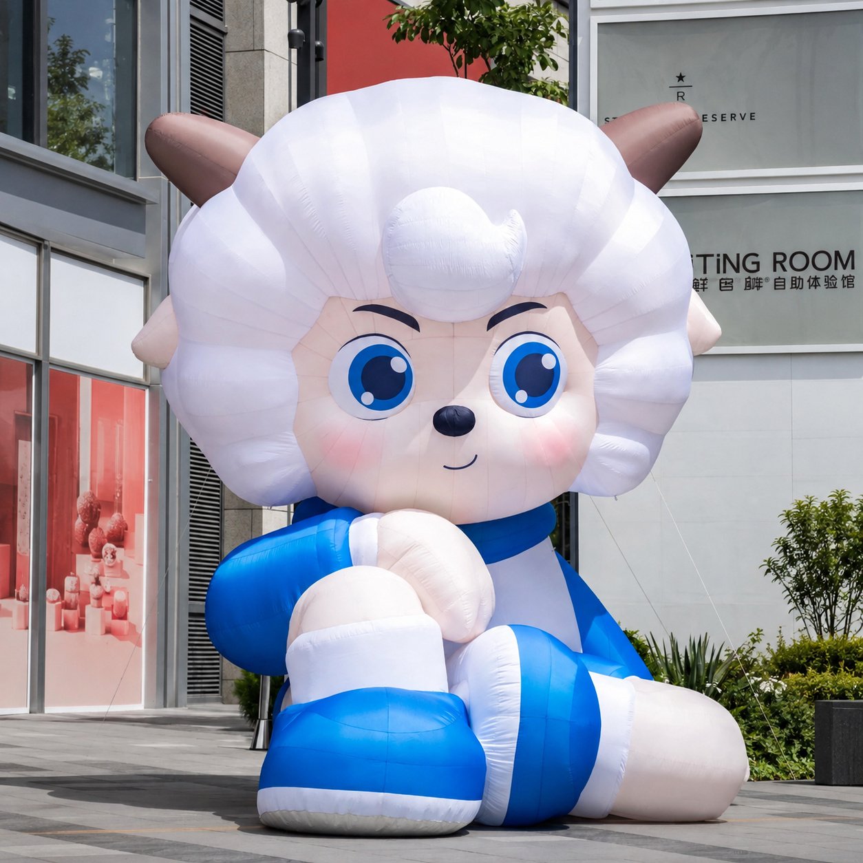 White inflatable sheep character wearing a blue outfit
